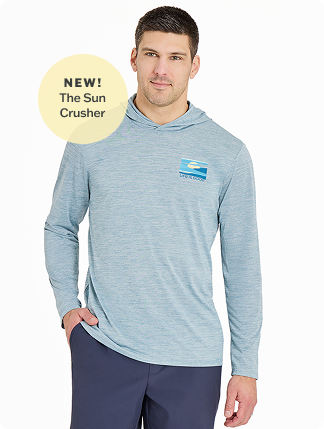 New! The Sun Crusher. Man wearing Men's Long Sleeve Sun Crusher Hoodie in smoky blue.