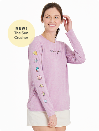 New! The Sun Crusher. Woman wearing women's long sleeve sun crusher tee in violet purple.